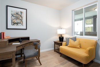 Living room seating at Village on Main Apartments - Photo Gallery 6