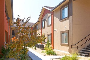 Outdoor Walkway at Vale Apartments & Townhomes - Photo Gallery 6
