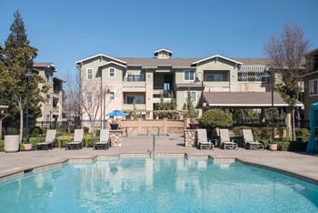 Pool With Sunning Deck Pool With Sunning Deck at Waterstone Apartments, Tracy, CA - Photo Gallery 2