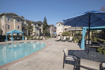 Relaxing Pool Area With Sundeck Relaxing Pool Area With Sundeck at Waterstone Apartments, Tracy, California - Photo Gallery 4