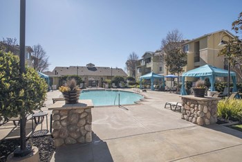 Pool with Cabana and Chairs at Waterstone Apartment Homes, California, 95377