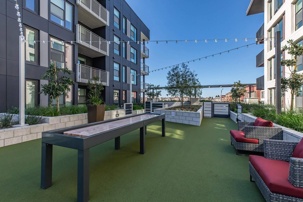 Outdoor Pool Table at The Platform Urban Apartments