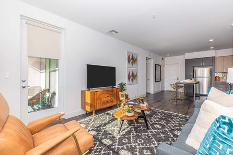 a living room with a couch and a tv