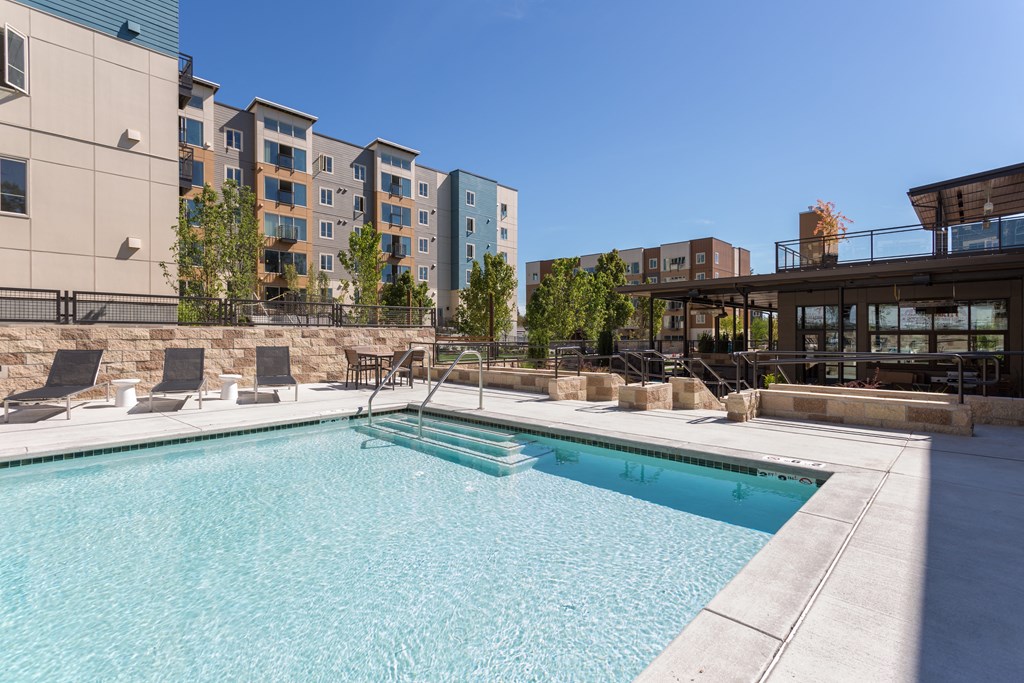 Pool With Sunning Deck at Tivalli Apartments, Washington