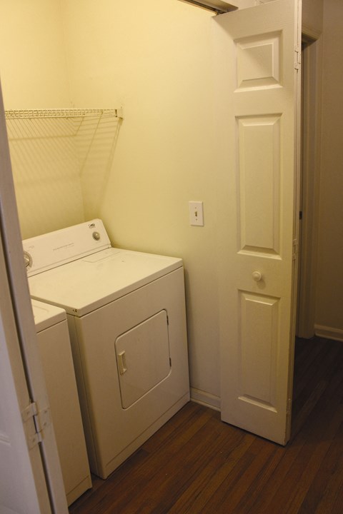a small laundry room with a washer and dryer