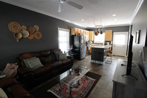 an open living room and kitchen with a couch and a table