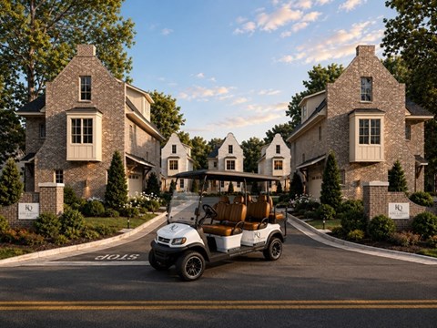 A golf cart is driving down a street past a large house.