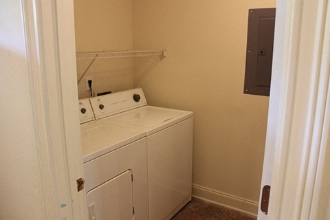 a laundry room with a washer and dryer in it