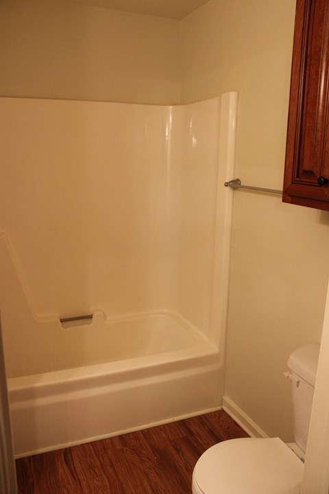 a small bathroom with a shower and a toilet