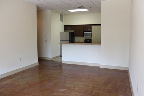 A kitchen area with a microwave and oven built into the cabinetry.