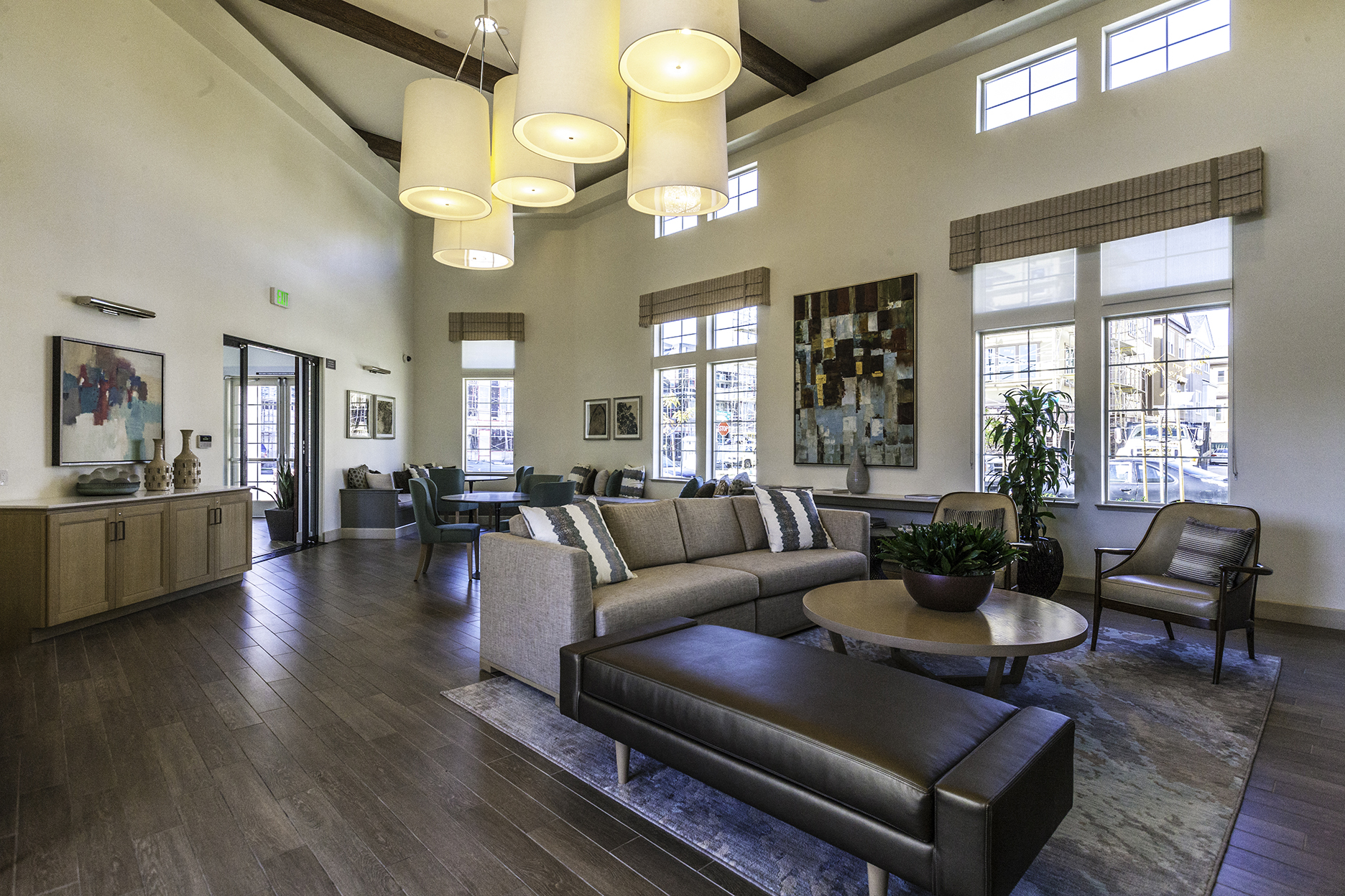 a living room with couches and chairs and a table