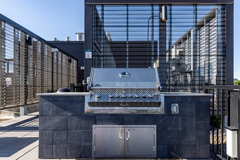 a barbecue grill on the side of a building