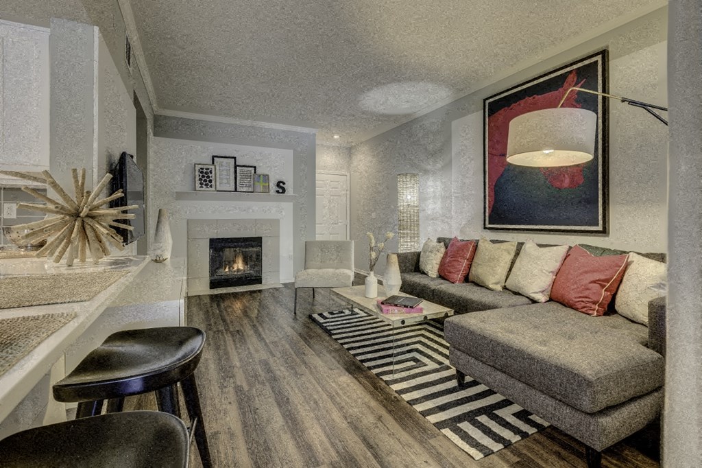 a living room with a couch and a fireplace