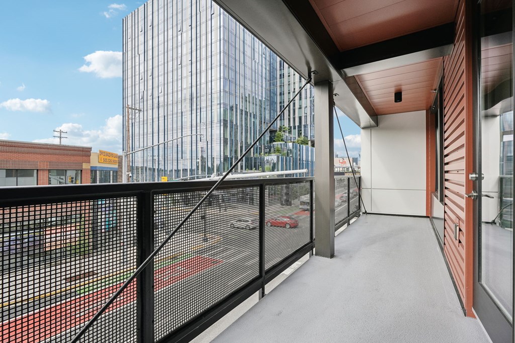 a balcony with a view of a building in the distance