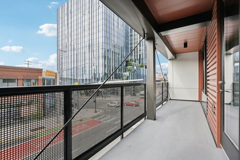 a balcony with a view of a building in the distance