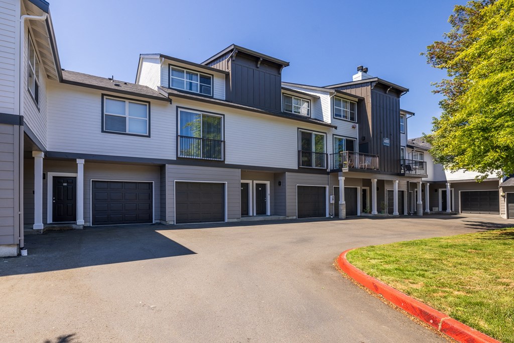 a house with a long driveway and a garage
