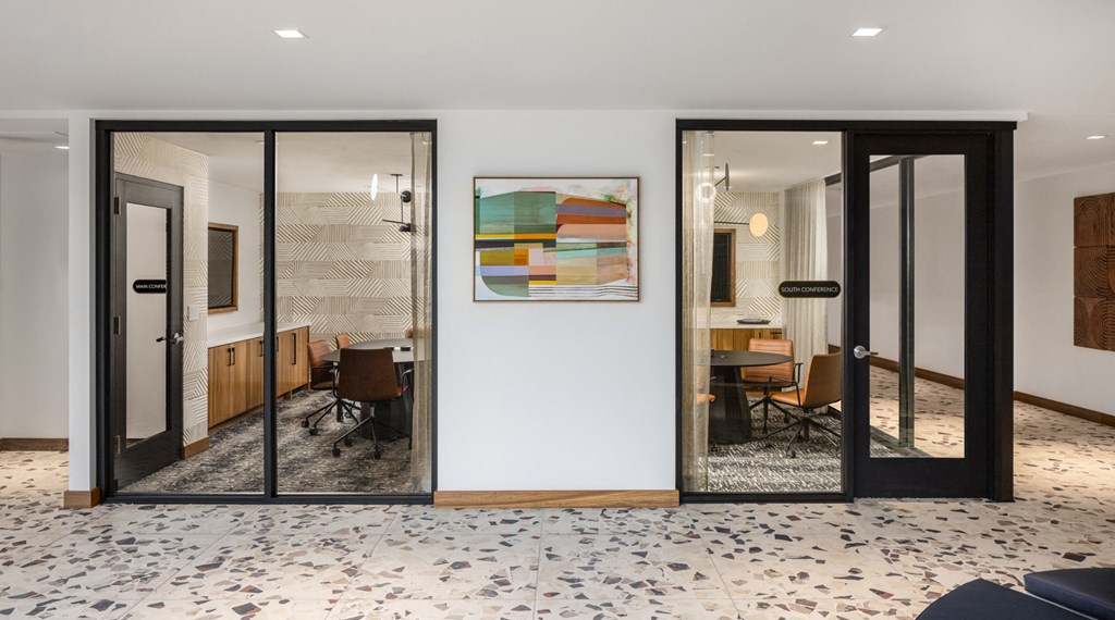 a living room and dining room with glass doors