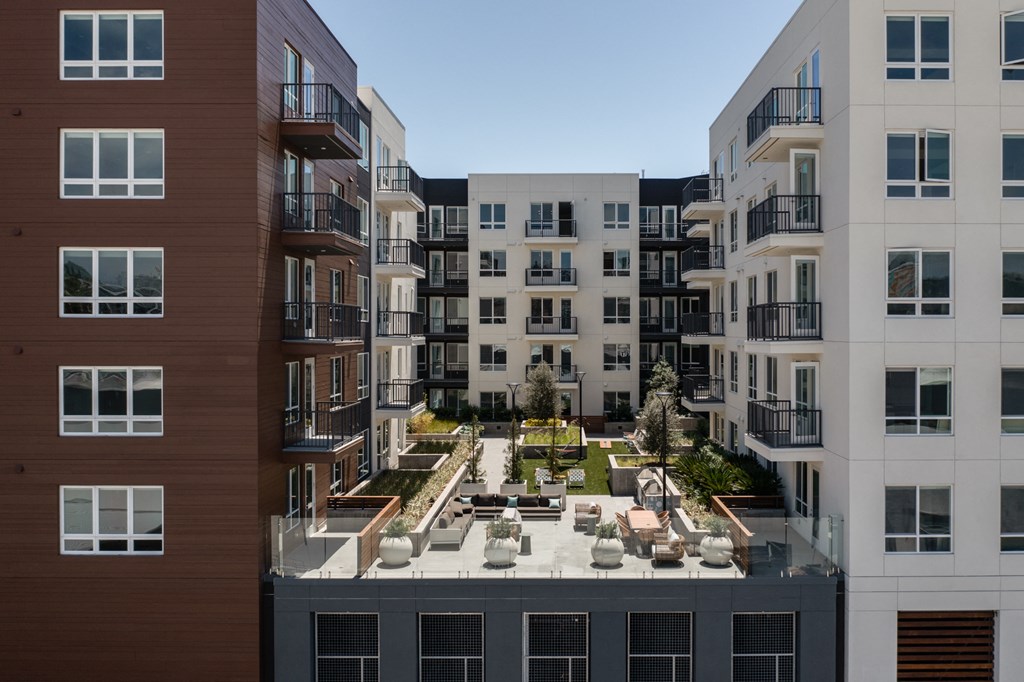 an aerial view of an apartment complex with a courtyard
