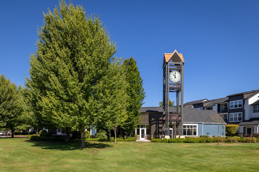a clock tower in front of a building