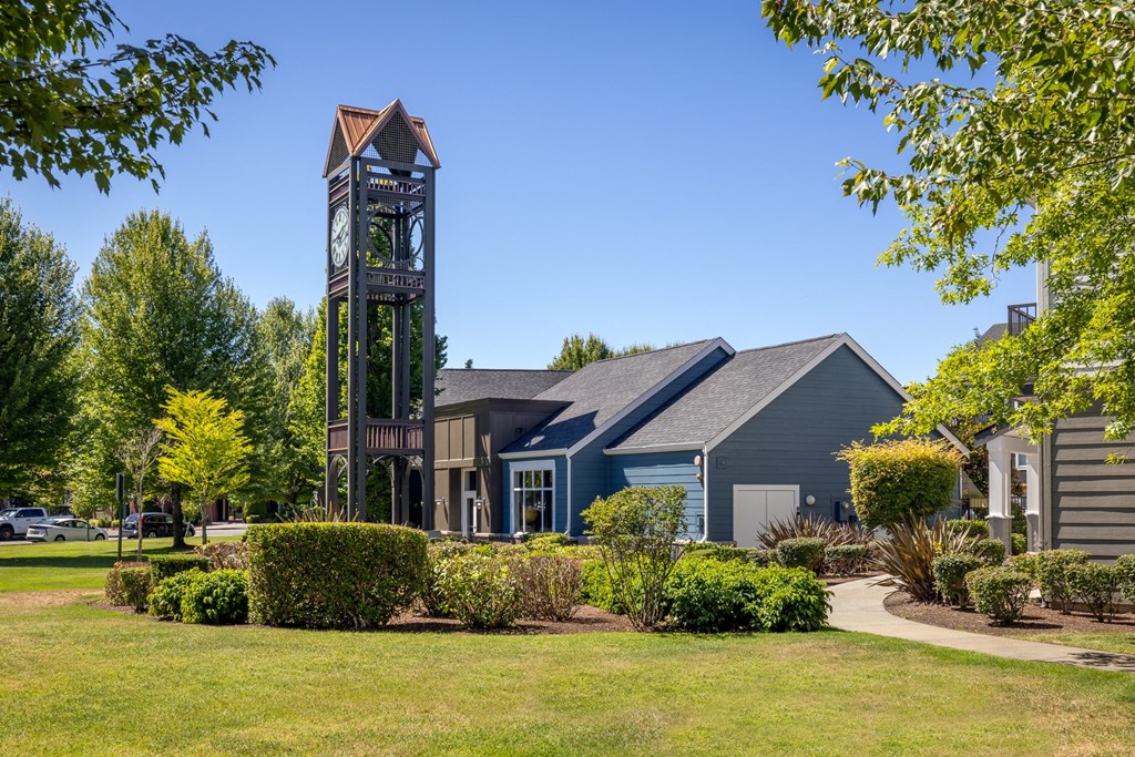 a building with a clock tower in front of it