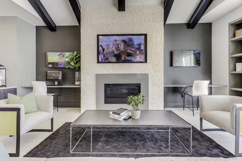 a living room with a fireplace and a table