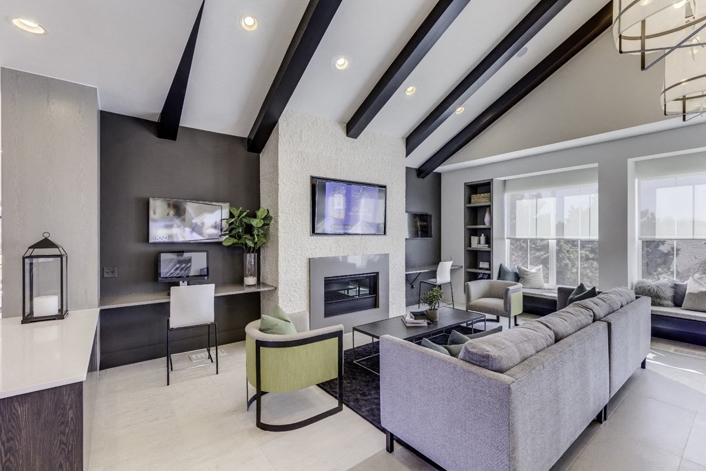 a living room with a couch and a fireplace