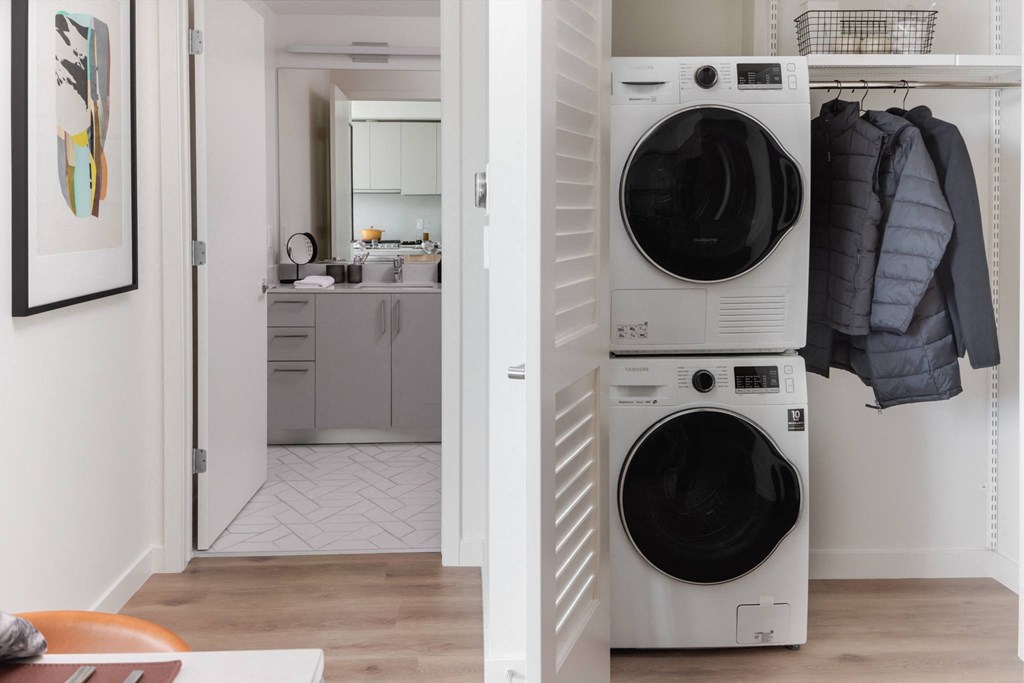 a small laundry room with a washing machine and a dryer