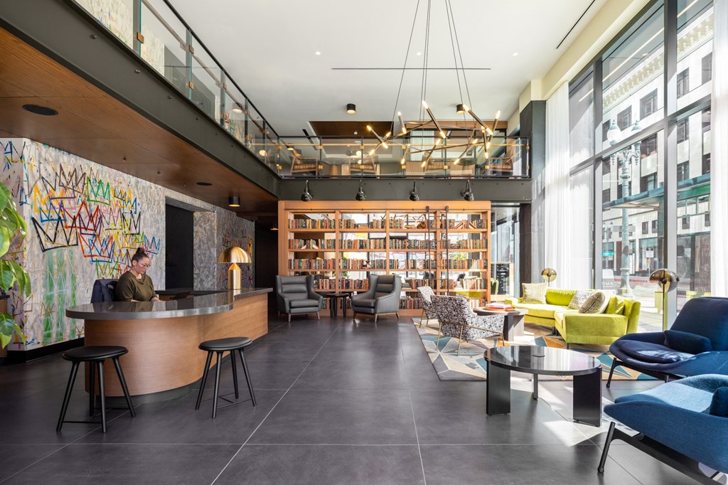 the lobby of the library at the ace hotel