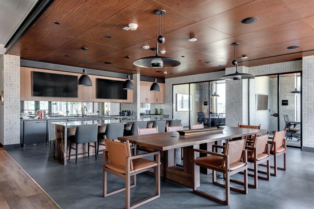 a large dining room with a long table and chairs