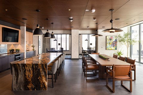 a large kitchen and dining room with a long table and chairs