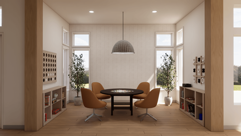 A modern dining room with a round table and chairs.