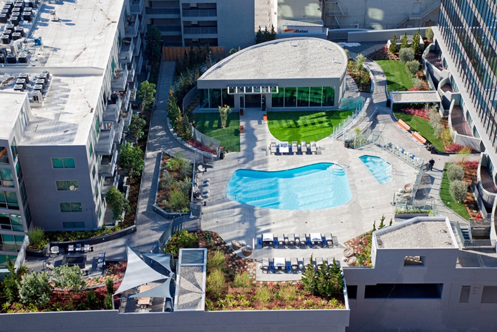 an aerial view of a building and a swimming pool