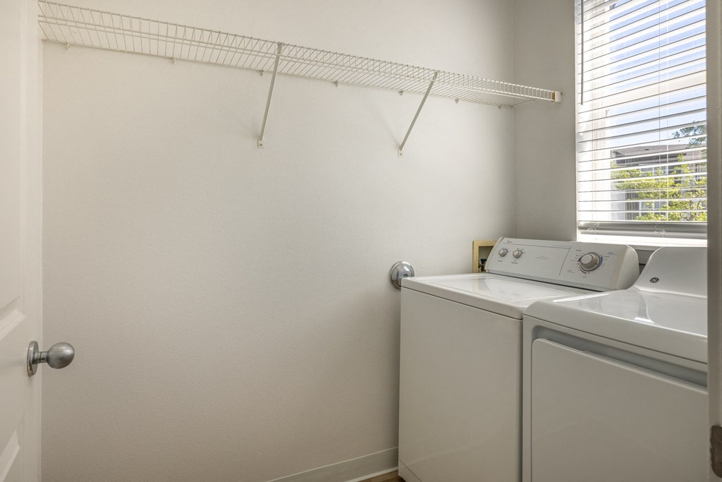 a laundry room with a washer and dryer