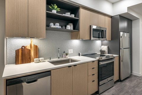 a kitchen with a sink and a refrigerator