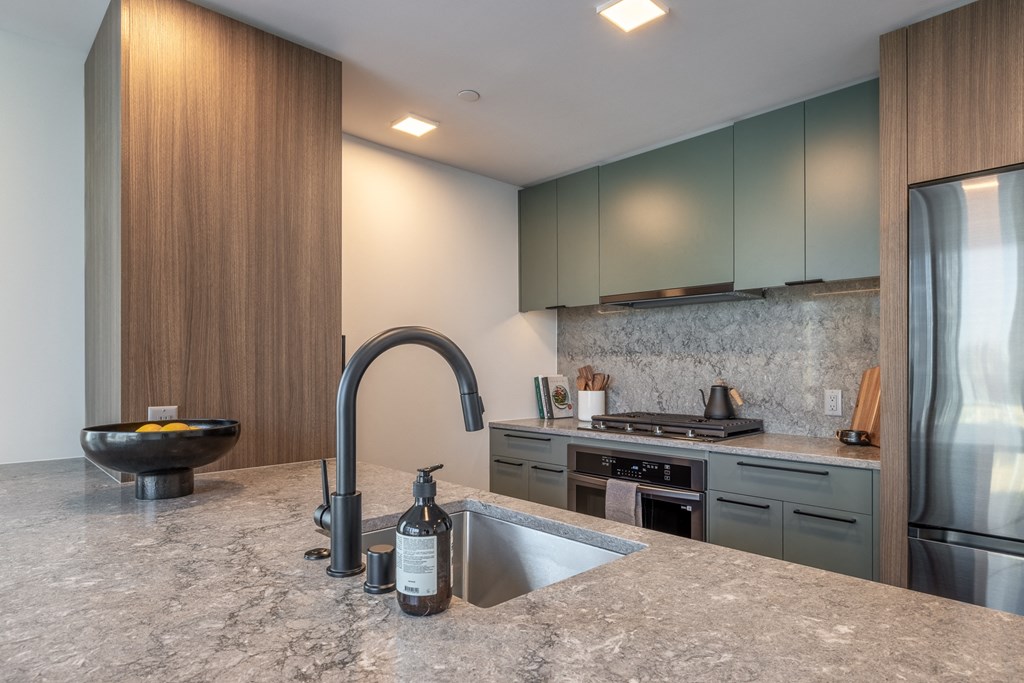 a kitchen with a sink and a stove