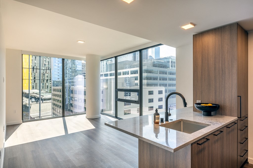 a kitchen with a large window and a sink