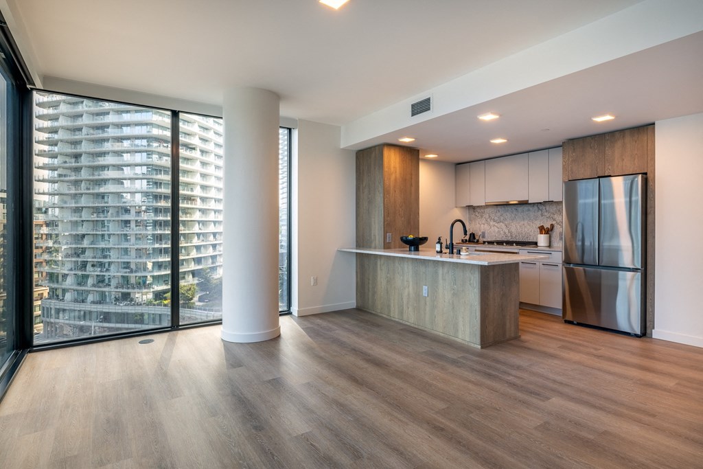 a kitchen and dining area in a 555 waverly unit