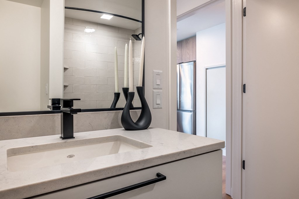 a bathroom with a sink and a mirror