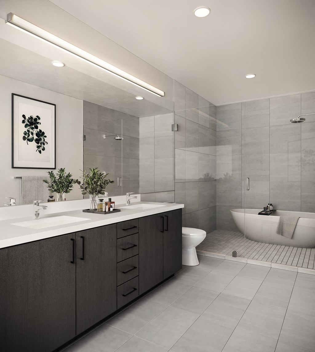 a bathroom with a sink and a toilet and a shower