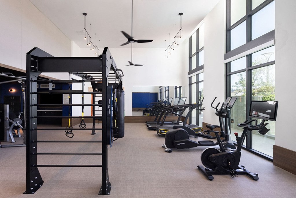 a room filled with lots of different types of exercise equipment