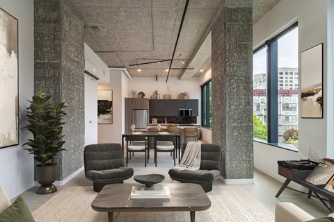 A modern living room with a grey sofa set and a coffee table.