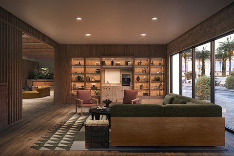 A modern living room with a green couch and a wooden coffee table.
