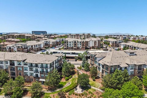 A large apartment complex with multiple buildings and greenery.