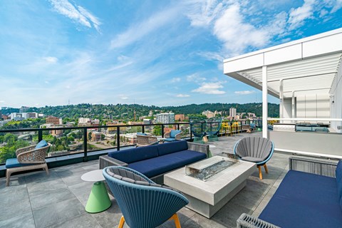 A rooftop patio with a view of the city.