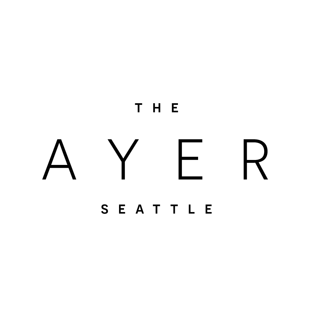 The Ayer Seattle logo on a green background.