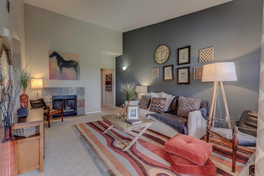 a living room with a couch and a fireplace