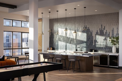 a kitchen with a large island and a pool table