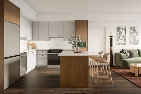 A modern kitchen with a wooden island and stools.