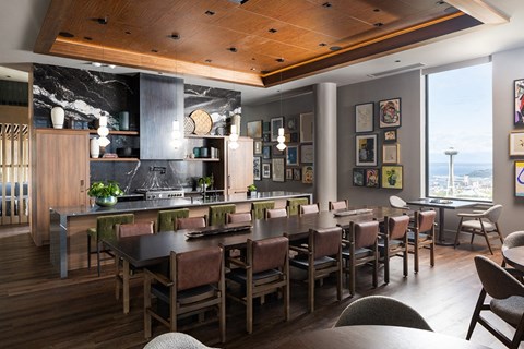 A modern kitchen with a dining table and chairs.