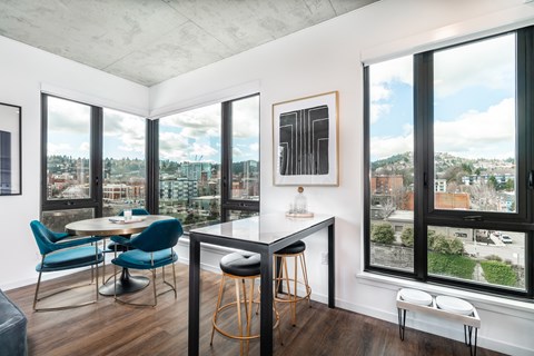 A modern kitchen with a table and chairs.